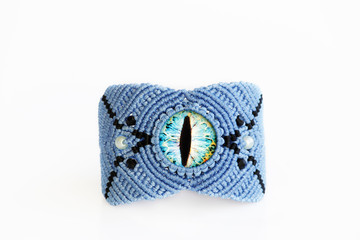blue bracelet for the hand from waxed thread, and blue dragon eye in the technique of macrame on a...