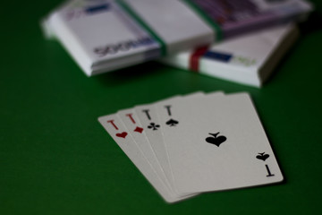cards and money on the green table