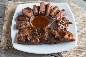 Grilled barbecue pork ribs on plate table background