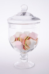 Candies. colorful candies in glass jar on background