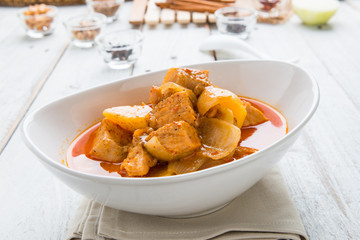Massaman pork curry on wood background. Coconut milk curry.