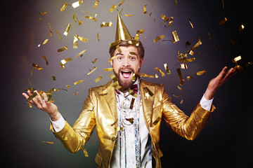 Portrait of man among confetti