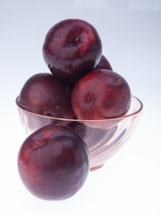 Plum. Ripe plum fruit on background