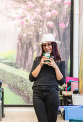 Beautiful girl drinking coffee at the coffee shop