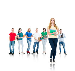 Obraz premium Large group of teenage students isolated on white background. Many different people standing together. School, education, college, university concept.