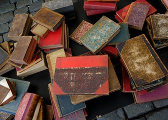 old books on a flea market stall / discarded books