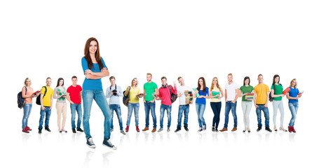 Obraz premium Large group of teenage students isolated on white background. Many different people standing together. School, education, college, university concept.