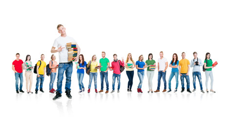 Fototapeta premium Large group of teenage students isolated on white background. Many different people standing together. School, education, college, university concept.