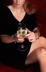 woman sipping wine in solitude
