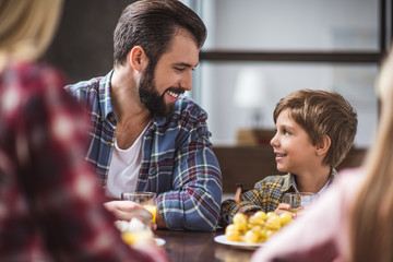 father and son having breakfast