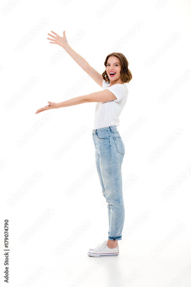 Poster cheerful pretty caucasian lady standing isolated showing copyspace.