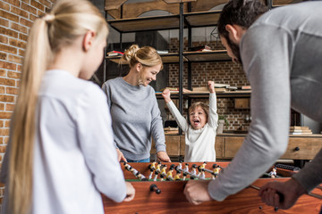family playing table football