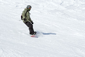 Fototapeta na wymiar snowboarder on the descent