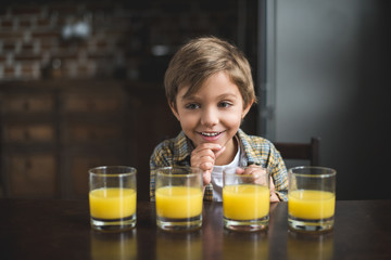 boy with glasses of juice