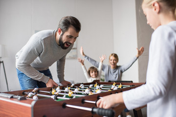 family playing table football