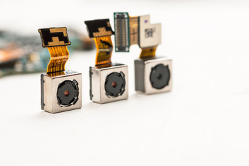 Smartphone camera modules on a white background, closeup