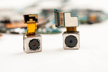 Smartphone camera modules on a white background, closeup
