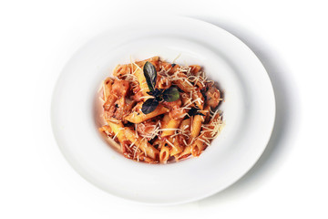 Italian Wholemeal Pasta Penne with Tuna, Tomato and Basil. Isolate on white. Italian cuisine concept. Copy space. Top view.