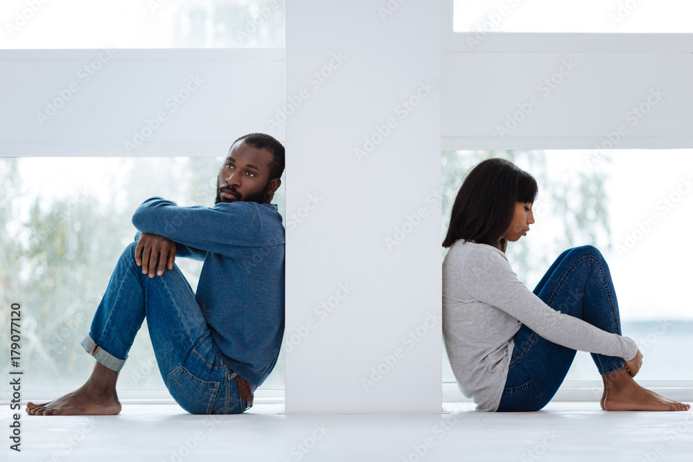 Wall mural Young loving people having problems in their small family