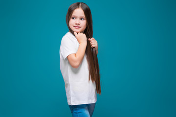 Cute girl in tee shirt with long hair