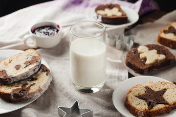 Biscuits and glass of milk. Milk and cake on wooden background