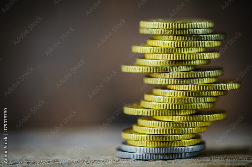 Wall mural coins stacked on each other in different positions. money saving concept.