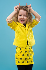 Cute young girl dressed all in yellow