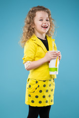 Cute young girl dressed all in yellow