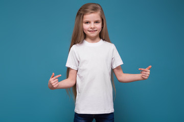 Little beauty girl in tee shirt with long brown hair
