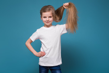 Little beauty girl in tee shirt with long brown hair