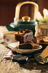 abstract topping chocolate cheese brownies cake with black tea