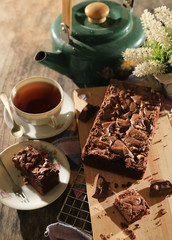 abstract topping chocolate brownies sliced cake with black tea 