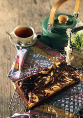 abstract topping chocolate brownies sliced cake with black tea 