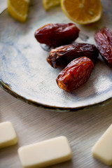Fun atmosphere of a cozy evening eating dates, oranges, dominoes and dreams about travel