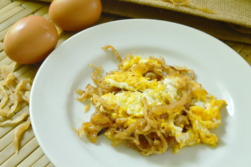 fried egg with sweet pickled radish on plate