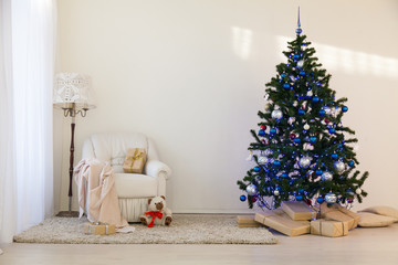 Christmas tree in a bright room new year gifts