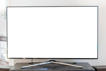 Blank white TV screen on a wooden stand in the living room