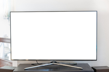 Blank white TV screen on a wooden stand in the living room