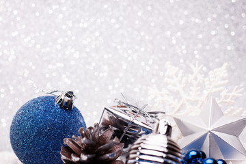 Christmas composition of Christmas tree toys on a silver background