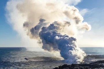 Papier Peint photo Île Eruption of a volcano on the Hawaiian island on the ocean. Volcanic activity. Tourism. Field of frozen black lava