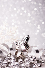 Christmas composition of Christmas tree toys on a silver background