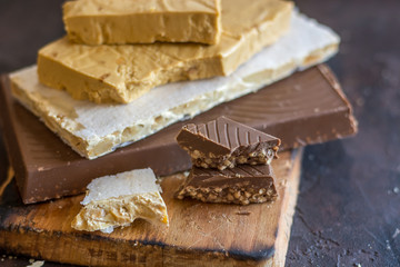 Various types of turrons,nougat, chocolate, nuts and soft nougat.