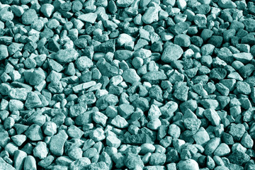 Pile of gravel stones in cyan tone