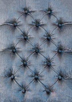 Decorative textile background with coach-type screed capitone chesterfield texture