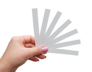 Female hand with paper test strips for perfume