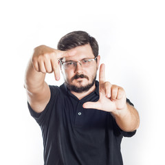 Portrait of 30 years old man with glasses and beard. Photographer or operator checking composition...