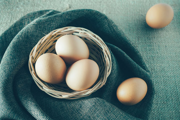 Eggs in a basket for cooking.