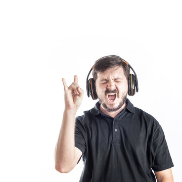 Portrait of 30 years old caucasian man listen rock music and sing loud song