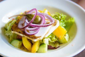 Close up plate with Greek salad in restaurant