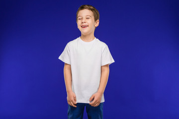 laughing boy in a vest